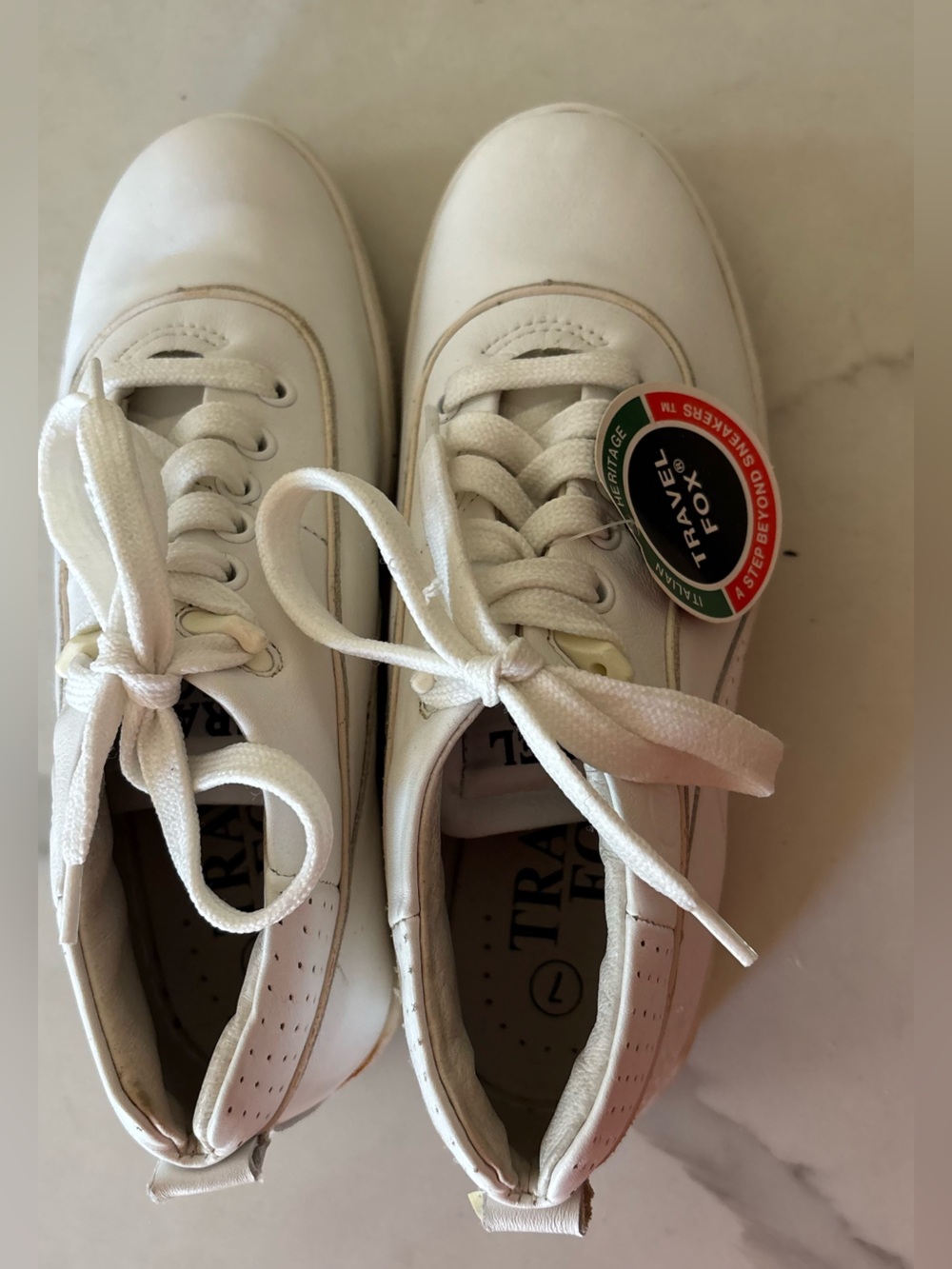 Travel Fox white sneakers size 7 back tab has a tear